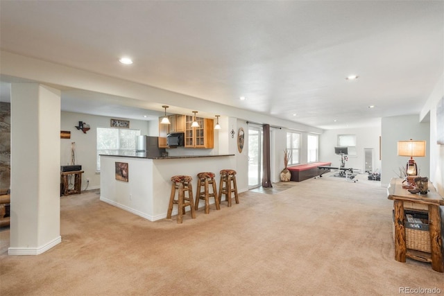 2105 Baguette Dr, Castle Rock, CO 80108 - living room with light colored carpet, plenty of natural light, and recessed lighting