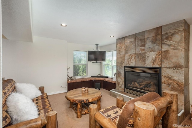 2105 Baguette Dr, Castle Rock, CO 80108 - living area featuring a tile fireplace, carpet flooring, and recessed lighting
