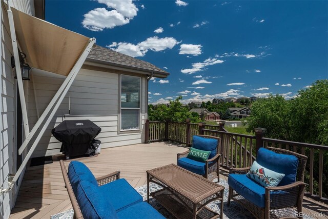 2105 Baguette Dr, Castle Rock, CO 80108 - wooden deck with area for grilling and an outdoor living space