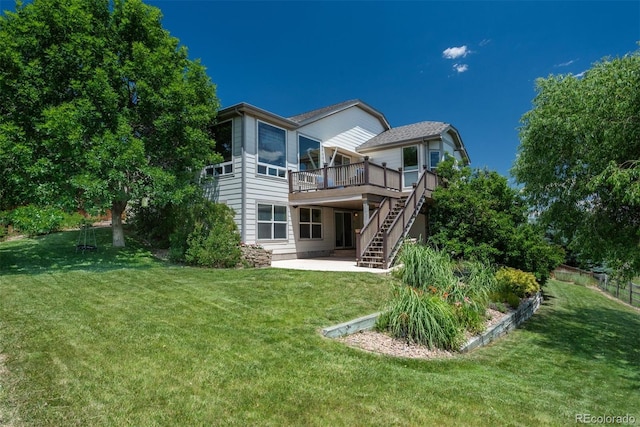 2105 Baguette Dr, Castle Rock, CO 80108 - rear view of house with a wooden deck, stairs, a patio, and a lawn