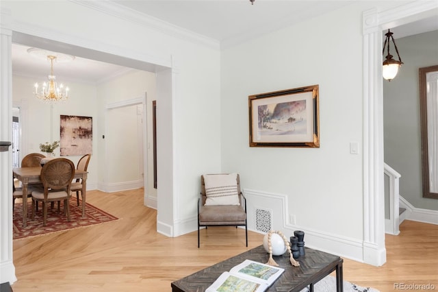 3147 Vallejo St, Denver, CO 80211 - sitting room featuring a chandelier, light wood-style floors, crown molding, and baseboards