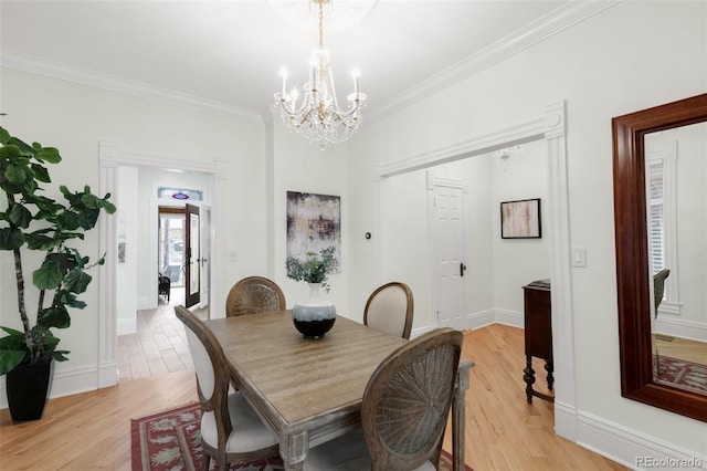 3147 Vallejo St, Denver, CO 80211 - dining room with a chandelier, light wood-type flooring, ornamental molding, and baseboards