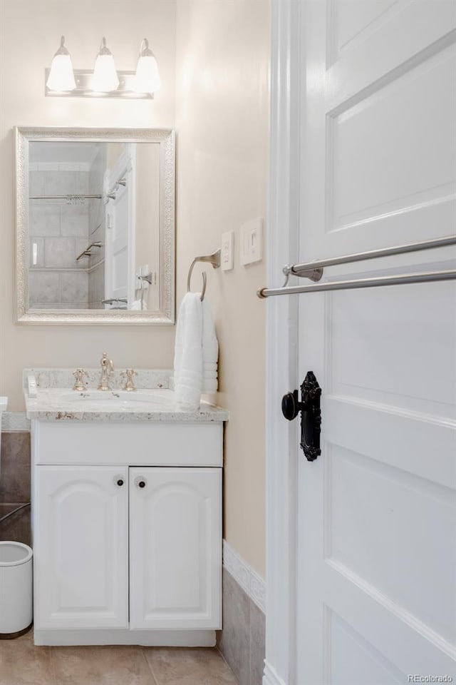 3147 Vallejo St, Denver, CO 80211 - bathroom featuring vanity, tile patterned flooring, and a shower