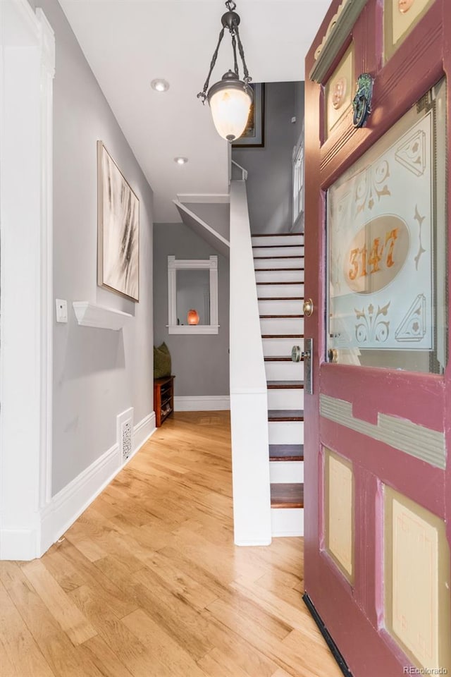 3147 Vallejo St, Denver, CO 80211 - entrance foyer featuring stairs, baseboards, light wood-style floors, and recessed lighting