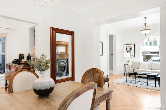 3147 Vallejo St, Denver, CO 80211 - dining room featuring ornamental molding, light wood-style flooring, and baseboards