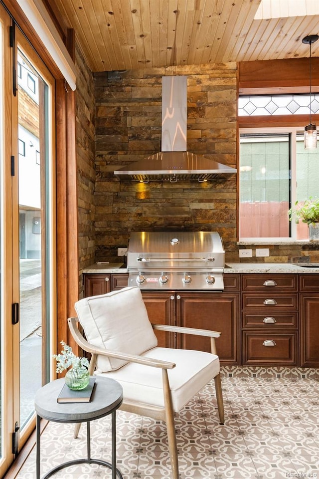 3147 Vallejo St, Denver, CO 80211 - kitchen featuring range hood, wood ceiling, plenty of natural light, wooden walls, and light stone countertops