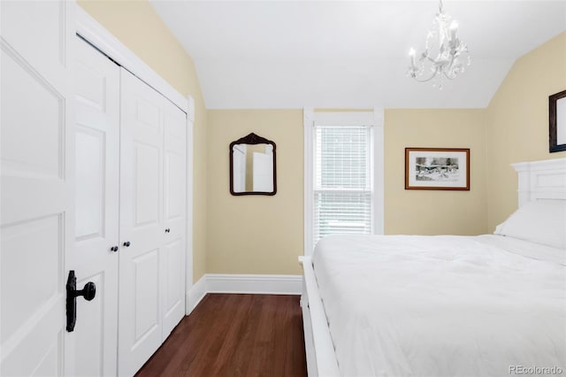 3147 Vallejo St, Denver, CO 80211 - bedroom with lofted ceiling, dark wood-style floors, a closet, baseboards, and a chandelier