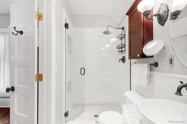 3147 Vallejo St, Denver, CO 80211 - bathroom featuring a sink, a stall shower, and toilet