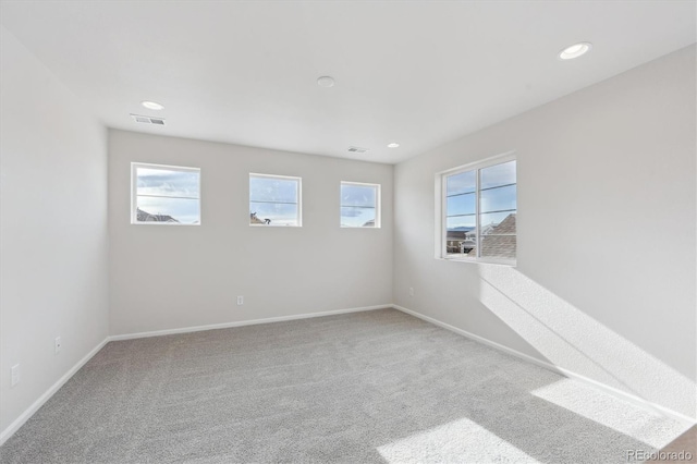 spare room featuring carpet flooring