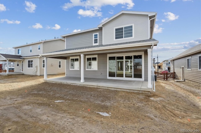 back of house with a patio area