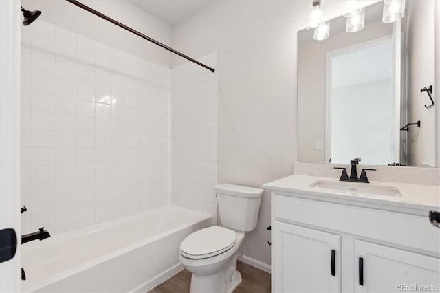 full bathroom featuring shower / tub combination, vanity, toilet, and wood-type flooring