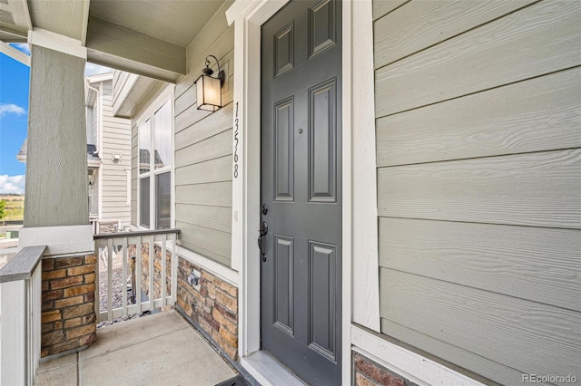 13568 E 111th Ave, Commerce City, CO 80022 - property entrance with covered porch and stone siding