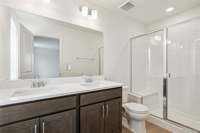 13568 E 111th Ave, Commerce City, CO 80022 - full bathroom with double vanity, a shower stall, and recessed lighting