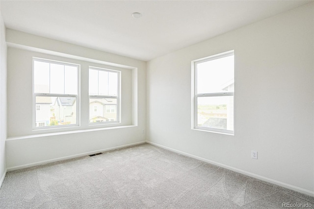 13568 E 111th Ave, Commerce City, CO 80022 - unfurnished room with plenty of natural light and carpet flooring