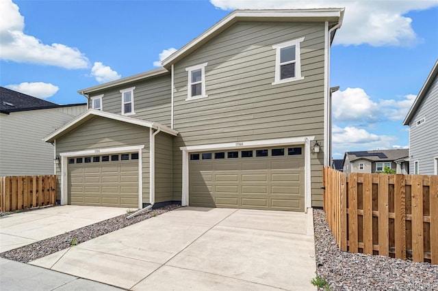13568 E 111th Ave, Commerce City, CO 80022 - traditional-style house featuring driveway and an attached garage