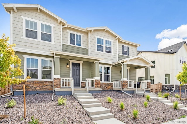 13568 E 111th Ave, Commerce City, CO 80022 - craftsman-style house with covered porch and stone siding