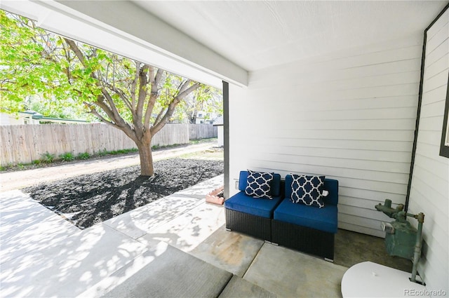 view of patio / terrace featuring fence