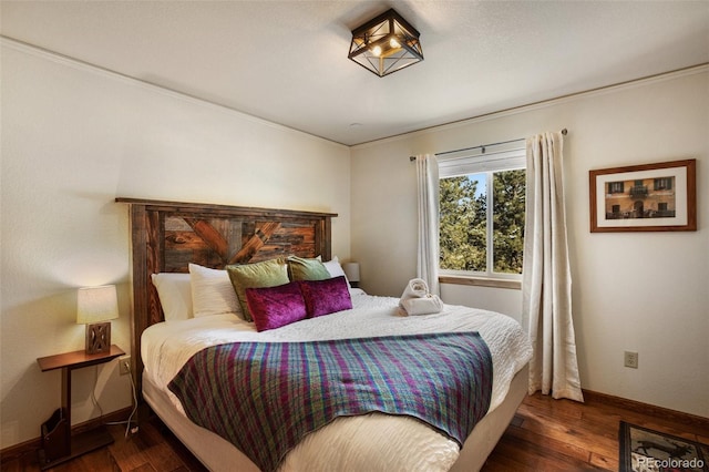 517 Crystal Peak Rd, Florissant, CO 80816 - bedroom with wood finished floors, baseboards, and crown molding