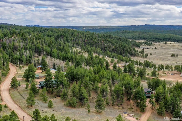 517 Crystal Peak Rd, Florissant, CO 80816 - aerial view of a heavily wooded area and mountains