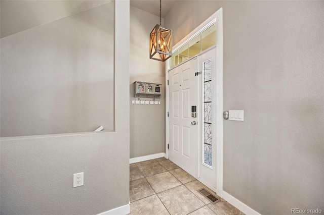 1522 Chimney Peak Dr, Castle Rock, CO 80109 - foyer entrance featuring a chandelier, light tile patterned flooring, and baseboards