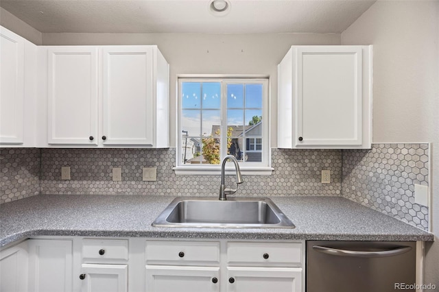1522 Chimney Peak Dr, Castle Rock, CO 80109 - kitchen featuring a sink, stainless steel dishwasher, white cabinetry, and decorative backsplash