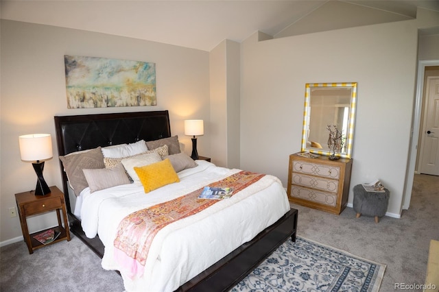 6845 S Webster St Unit E, Littleton, CO 80128 - carpeted bedroom featuring baseboards and lofted ceiling