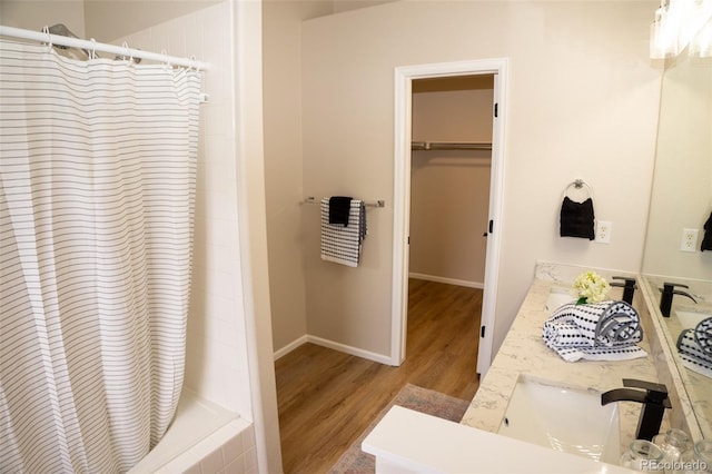 6845 S Webster St Unit E, Littleton, CO 80128 - bathroom with wood finished floors, double vanity, and a spacious closet