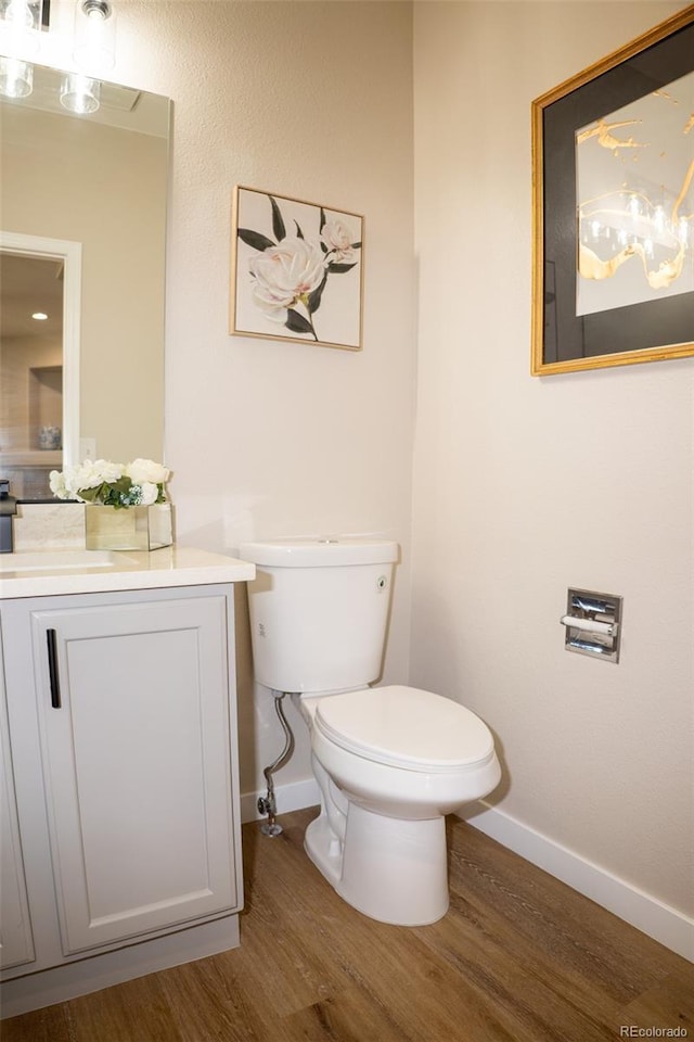 6845 S Webster St Unit E, Littleton, CO 80128 - bathroom featuring wood finished floors and vanity