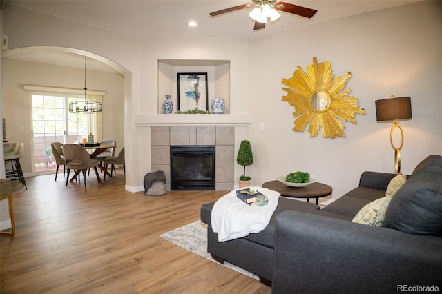 6845 S Webster St Unit E, Littleton, CO 80128 - living area featuring recessed lighting, wood finished floors, arched walkways, ceiling fan, and a chandelier
