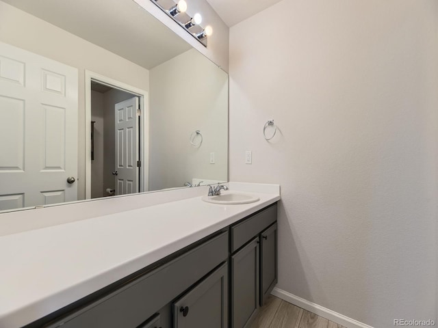 917 White Leaf Cir, Castle Rock, CO 80108 - bathroom with baseboards, vanity, and wood finished floors
