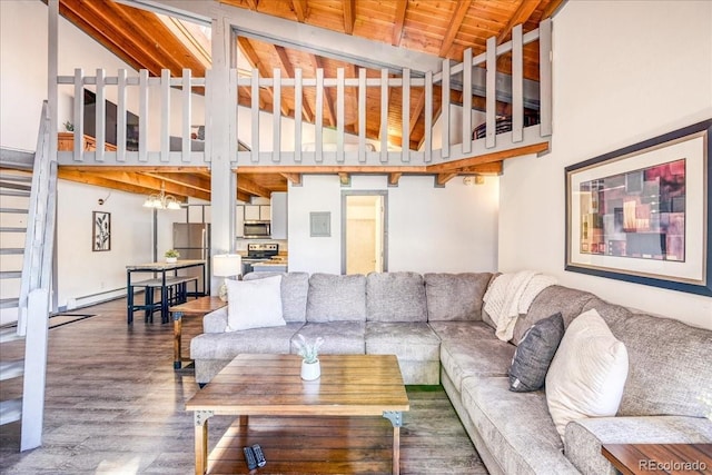 8300 Ryan Gulch Rd Unit F306, Silverthorne, CO 80498 - living room featuring wood finished floors, a baseboard heating unit, beamed ceiling, high vaulted ceiling, and wood ceiling