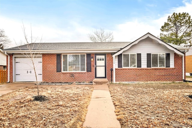 2438 W 24th Street Rd, Greeley, CO 80634 - ranch-style home featuring brick siding, an attached garage, driveway, and a shingled roof
