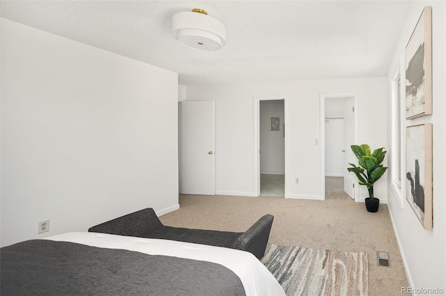 6463 S Vance St, Littleton, CO 80123 - carpeted bedroom with a walk in closet and baseboards