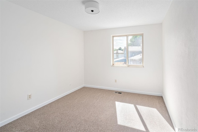 6463 S Vance St, Littleton, CO 80123 - unfurnished room with carpet and a textured ceiling