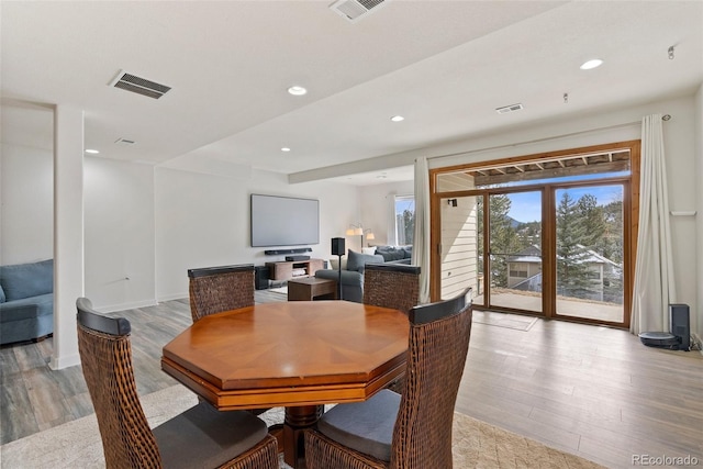 dining space featuring recessed lighting, visible vents, and light wood-style floors