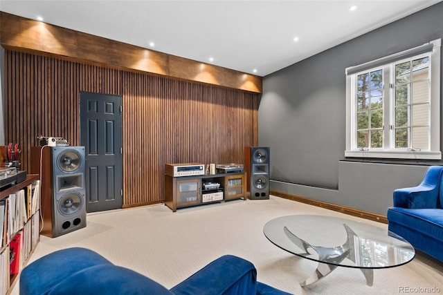 living area with recessed lighting, light carpet, and baseboards