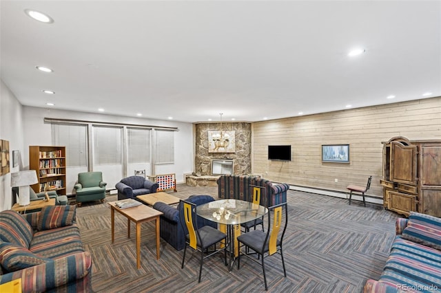 107 N Harris St Unit 102, Breckenridge, CO 80424 - living room featuring recessed lighting, a baseboard heating unit, dark carpet, wood walls, and a fireplace