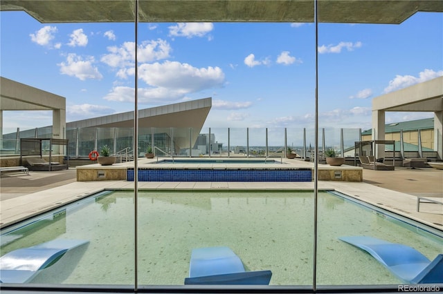 view of swimming pool featuring a patio area