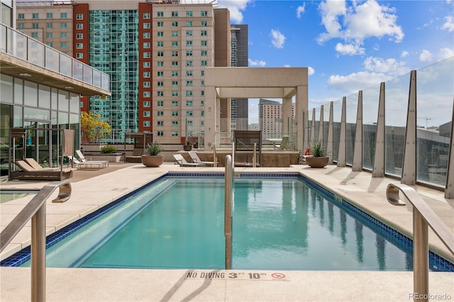 view of pool featuring a patio