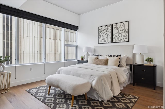 bedroom with hardwood / wood-style flooring