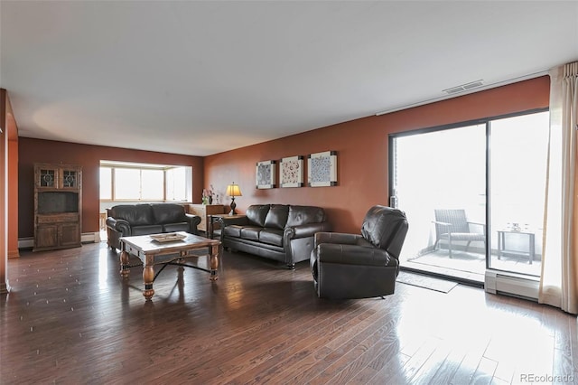 3131 E Alameda Ave Unit 704, Denver, CO 80209 - living area with wood finished floors and baseboard heating