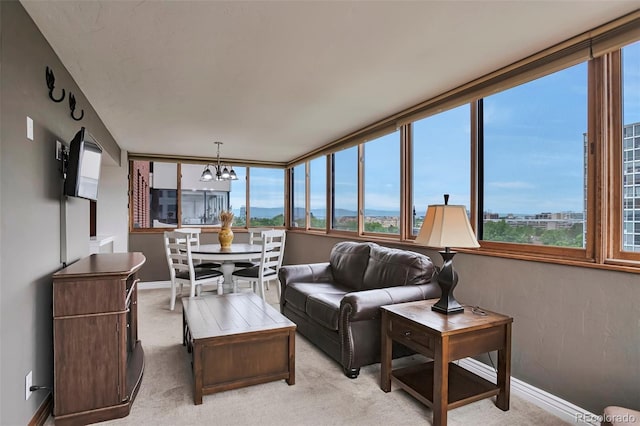 3131 E Alameda Ave Unit 704, Denver, CO 80209 - sunroom featuring healthy amount of natural light and a chandelier