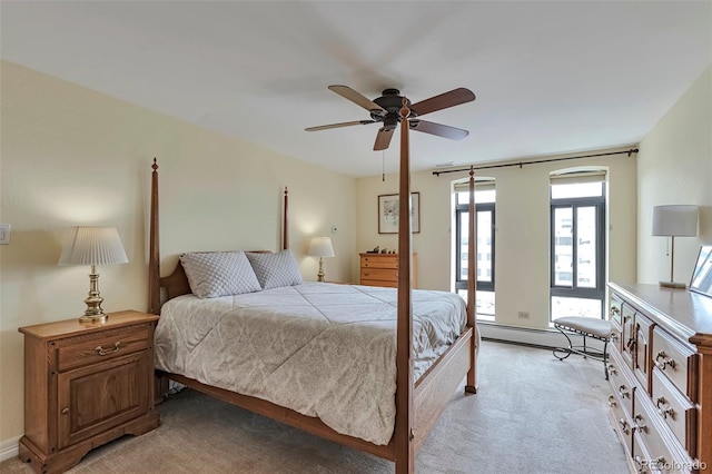 3131 E Alameda Ave Unit 704, Denver, CO 80209 - bedroom with baseboard heating, light colored carpet, and ceiling fan