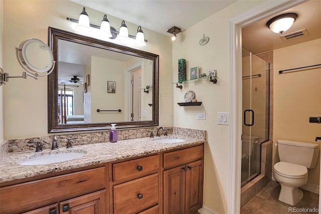 3131 E Alameda Ave Unit 704, Denver, CO 80209 - bathroom with a stall shower, toilet, double vanity, and tile patterned floors