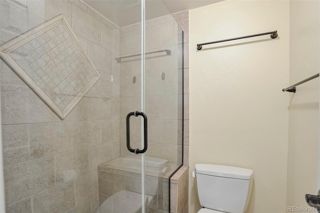 3131 E Alameda Ave Unit 704, Denver, CO 80209 - full bathroom featuring a stall shower and toilet