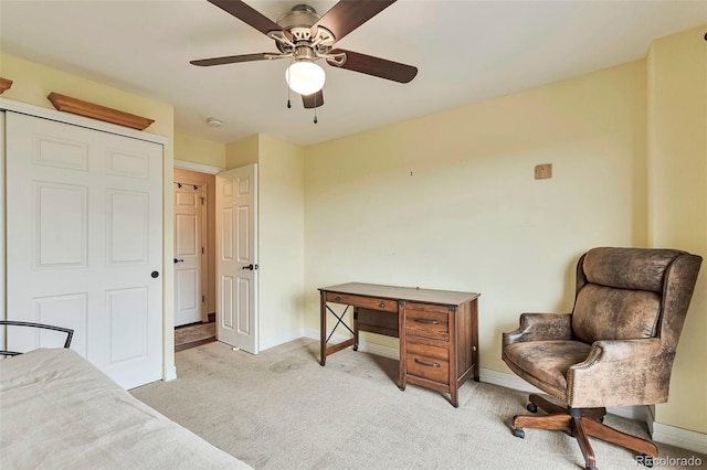 3131 E Alameda Ave Unit 704, Denver, CO 80209 - bedroom featuring light carpet, baseboards, and a ceiling fan