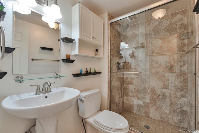 3131 E Alameda Ave Unit 704, Denver, CO 80209 - bathroom featuring toilet and a shower stall