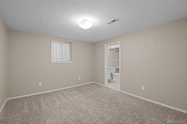 unfurnished bedroom featuring visible vents, baseboards, and carpet