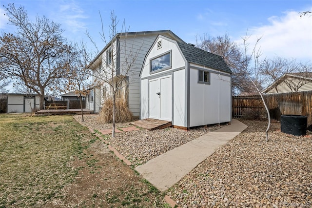 view of shed featuring a fenced backyard