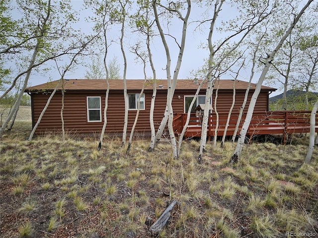 631 Arrowhead Dr, Jefferson, CO 80456 - back of house featuring faux log siding and a deck